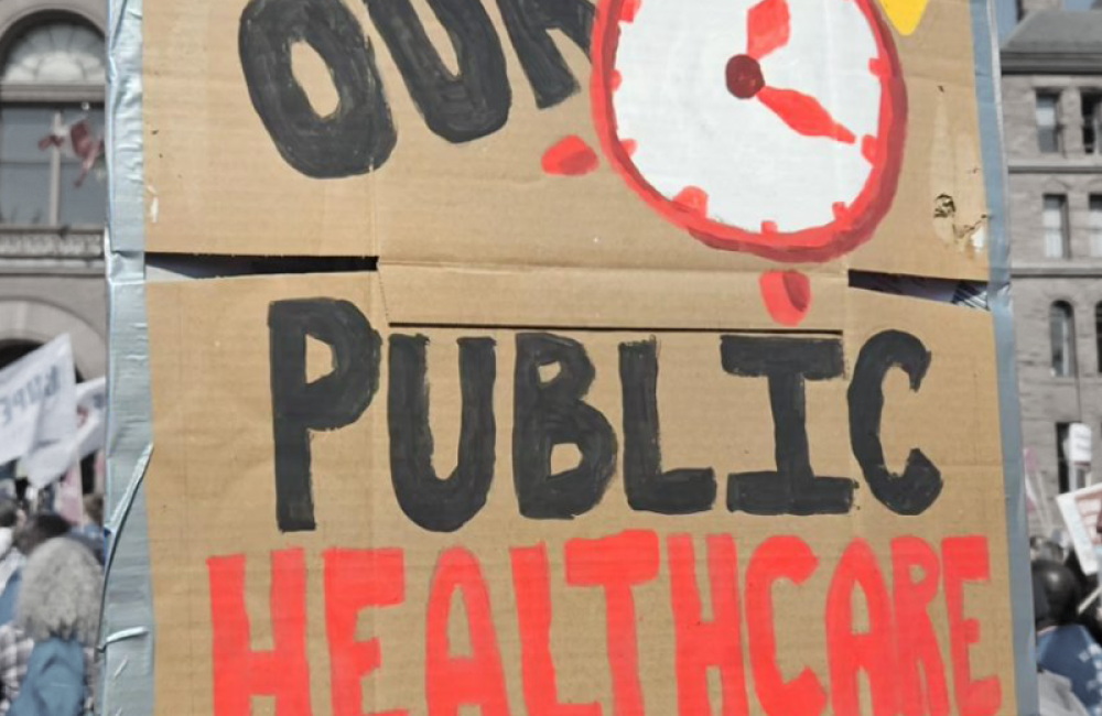 Protest sign at Queen's Park that says "Save our Public Healthcare"